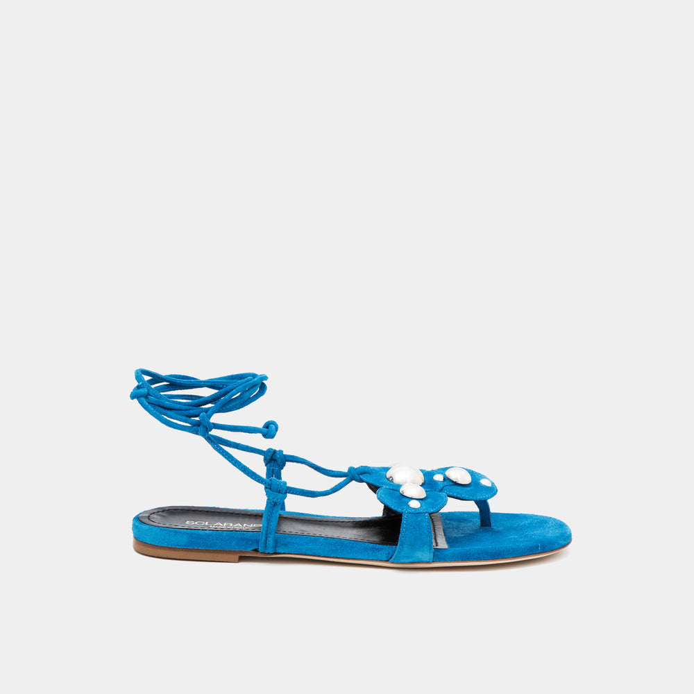 Azure Suede Oversized studded flat thong with an ankle-tie