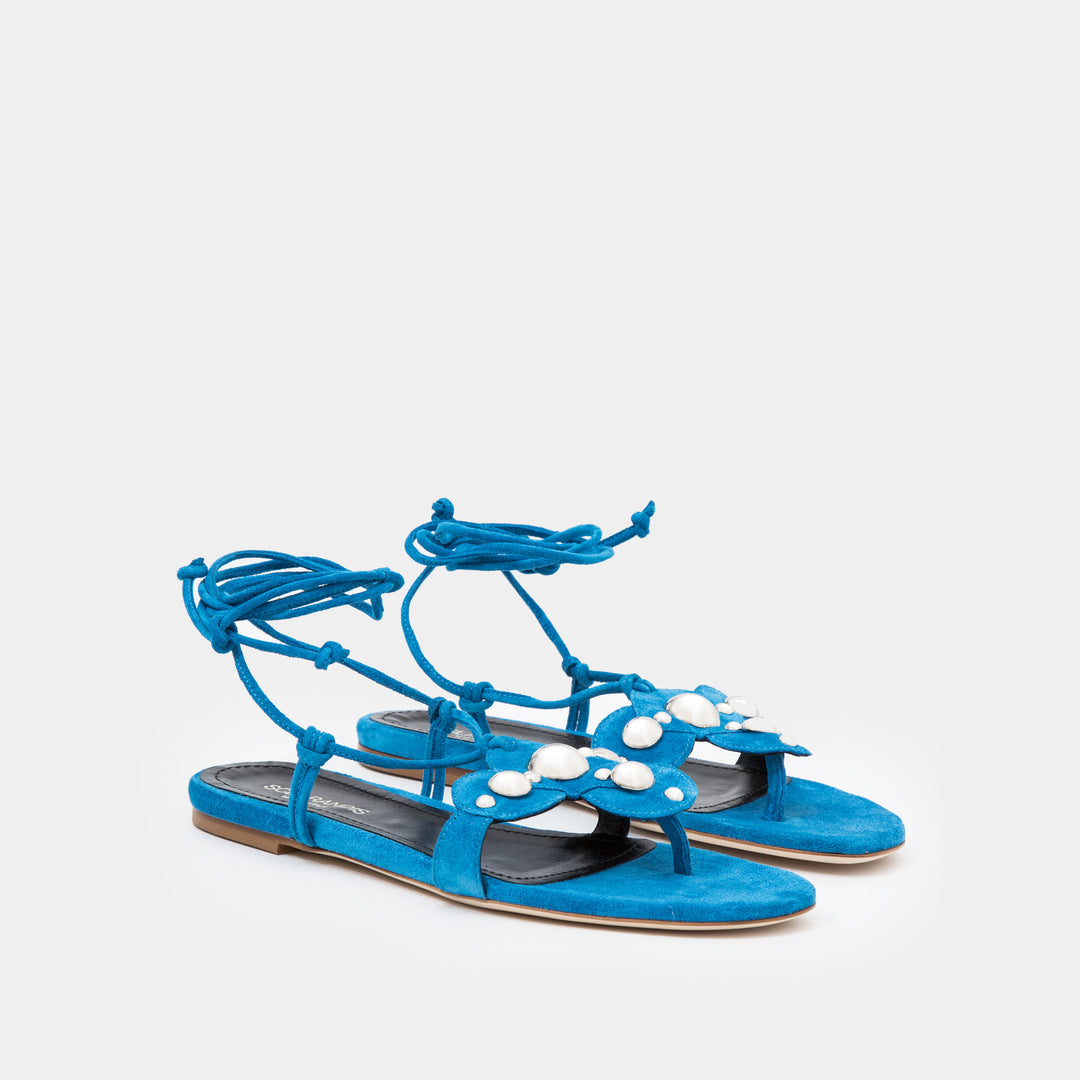 Azure Suede Oversized studded flat thong with an ankle-tie