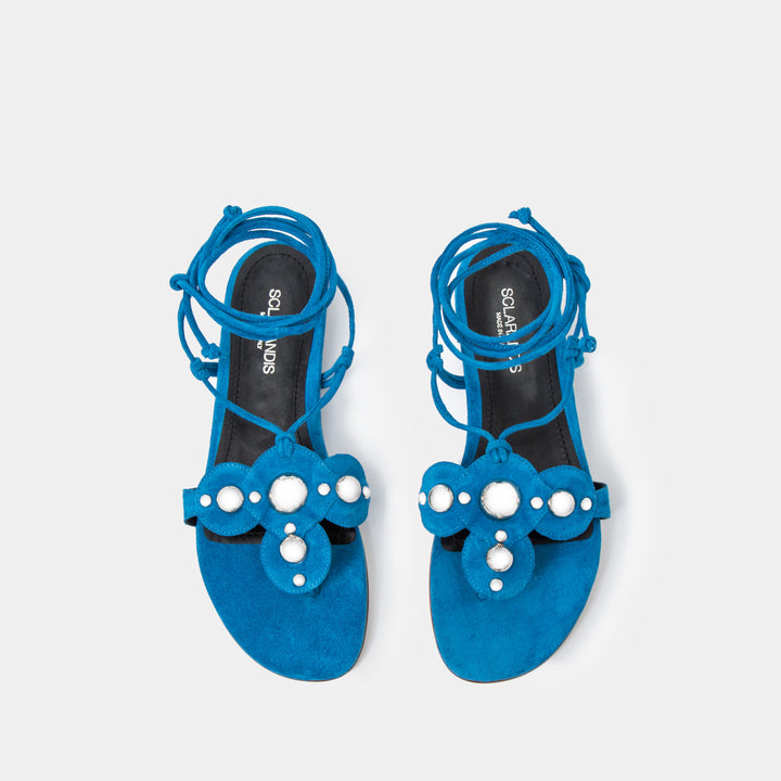 Azure Suede Oversized studded flat thong with an ankle-tie