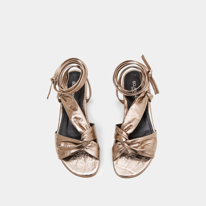 Bronze metallic Knotted nappa flat sandal with an ankle tie wrap